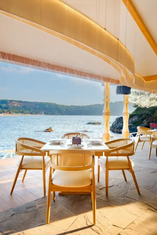 Seaside table with panoramic ocean and coastline view