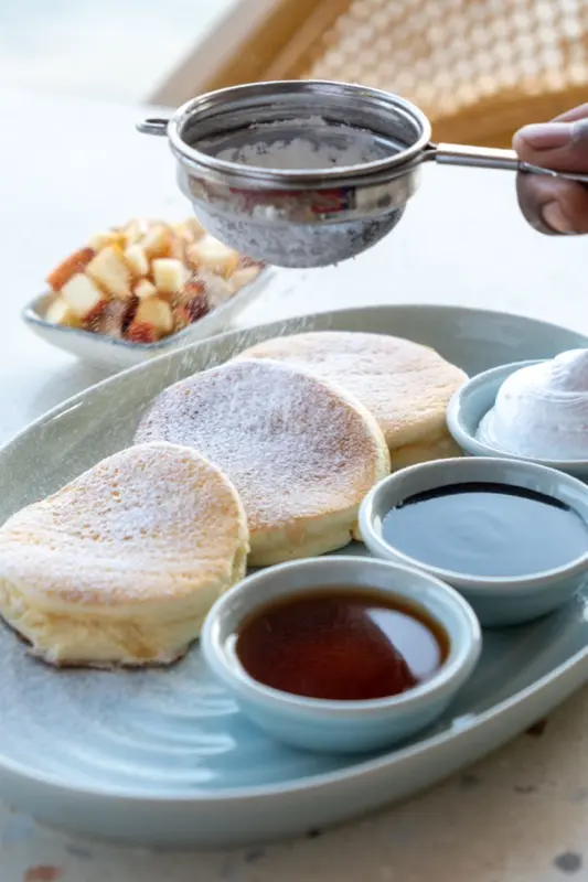 Japanese souffle pancakes with maple syrup and cream