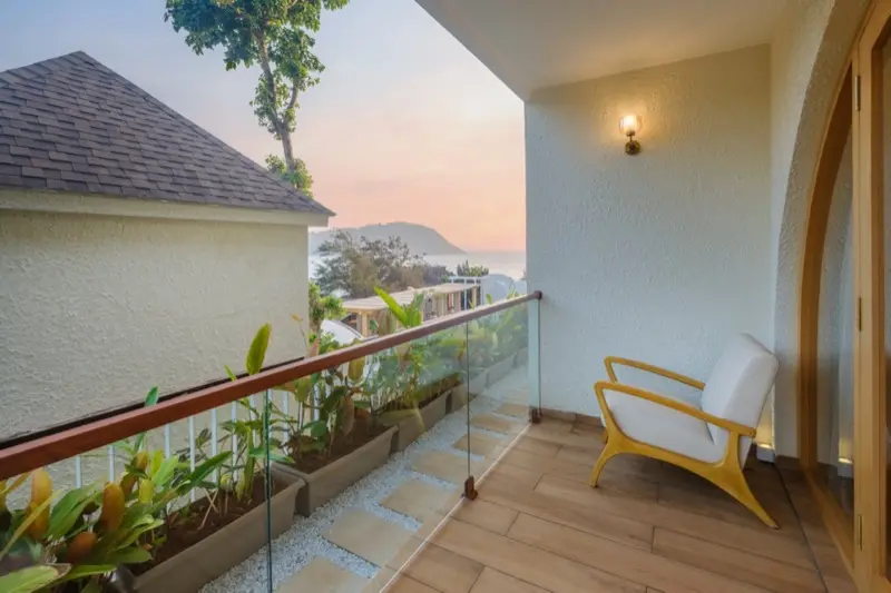 Private villa balcony with sunset over Gokarna coastline