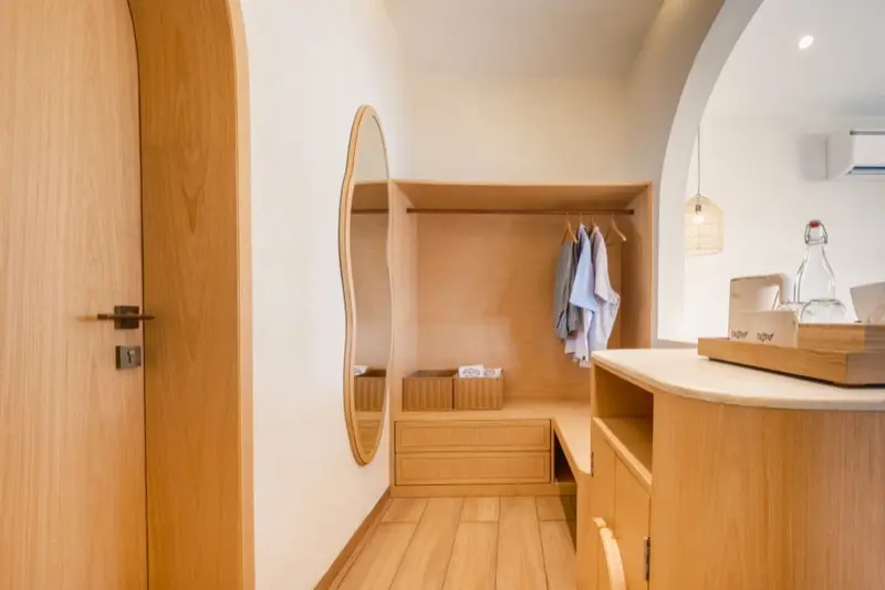 Wardrobe and dressing area with arched doorways