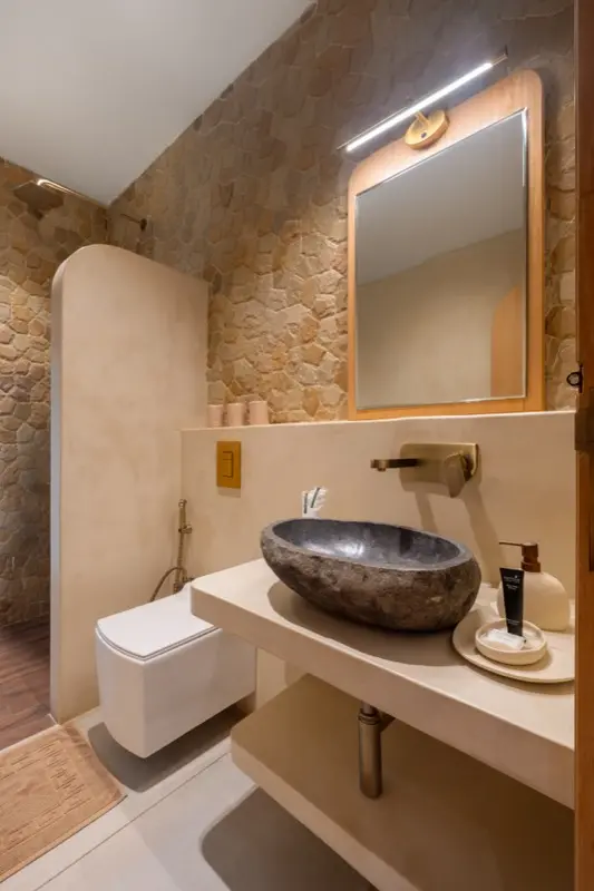 Close-up bed angle with sea view through arched balcony door